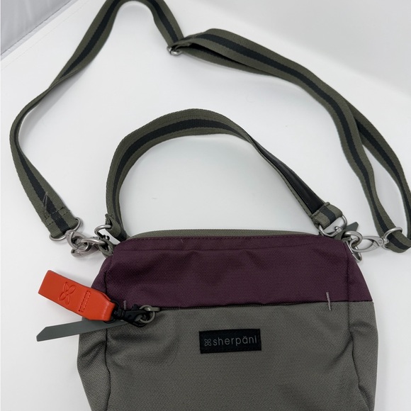 Sherpani Greenish Gray Purple Colorblock Crossbody Bag Logo Zipper Bag Charm - Picture 2 of 12